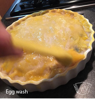 Egg washing chicken pie ingredients in-the-mould