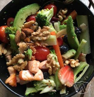 Salad bowl of Salmon, Avocado, Broccoli, Cherry Tomato, Strawberry, Walnuts