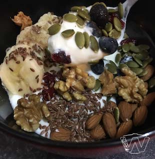 Salad bowl of Yogurt nuts and seeds milk